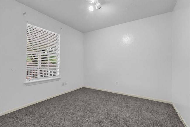 Another secondary bedroom is located on the second floor, ready for your personal touch. | Image 22