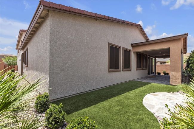 Back of house with stucco siding and a patio area | Image 31