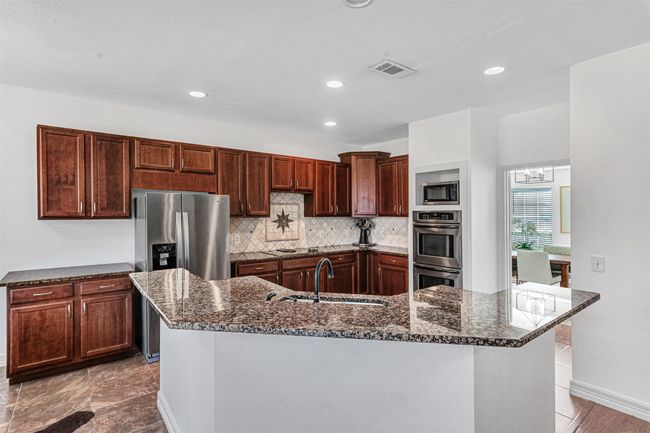 kitchen leads into formal dining area | Image 19