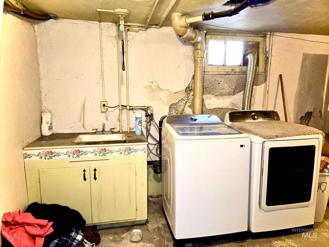 Washroom featuring washer and clothes dryer | Image 20