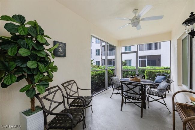 Patio with ceiling fan and plenty of seating | Image 21