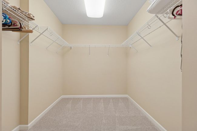 You'll love this generously sized walk-in closet! | Image 16