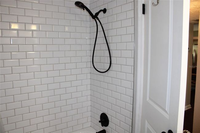 Guest bath has tub shower | Image 25