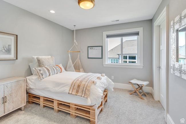 Carpeted bedroom featuring baseboards | Image 46