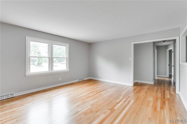 Unfurnished room featuring light wood-style floors and baseboards | Image 4