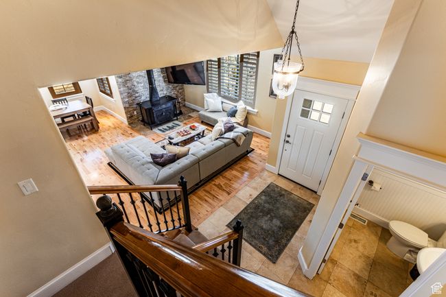 Foyer entrance featuring baseboards and a wood stove | Image 25