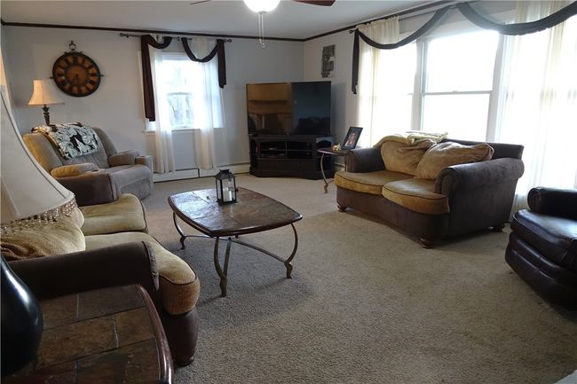 Spacious Living Room with Gas Fireplace and Picture Window | Image 4