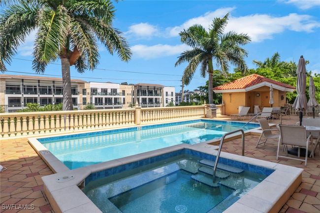 Community pool with a community hot tub and a patio | Image 21