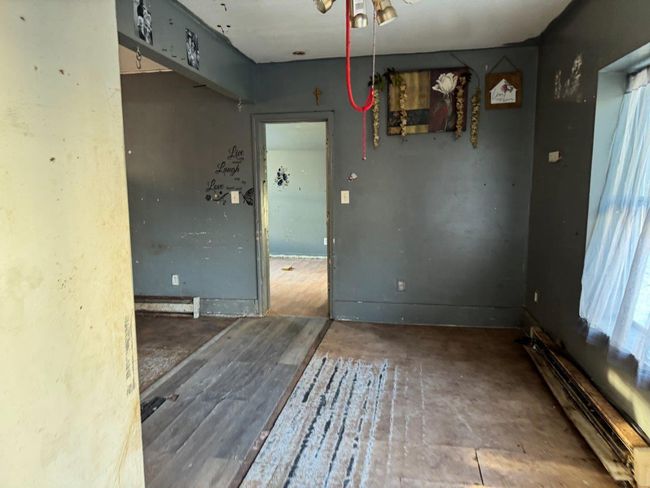 Unfurnished dining area with baseboard heating | Image 8