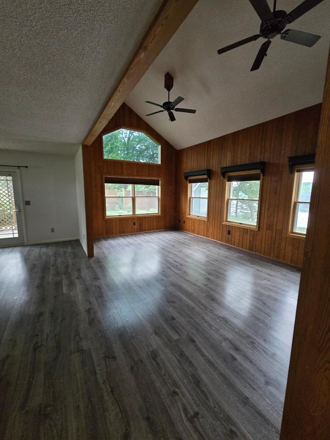 High vaulted ceilings and the wall of windows makes for so much natural light in the living room | Image 7