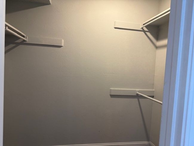 View of spacious closet | Image 7