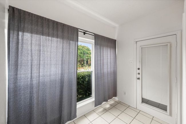 Foyer entrance with light tile patterned flooring | Image 5