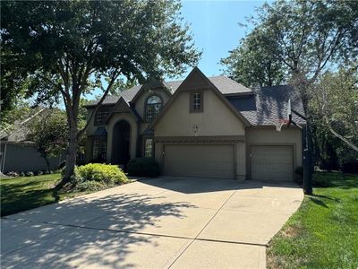 View of front facade featuring a garage and a front yard | Image 2