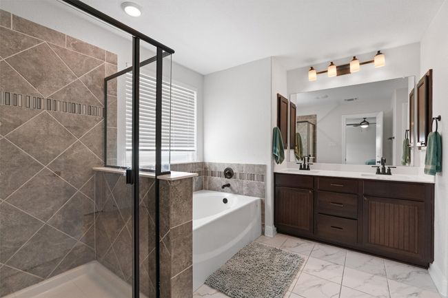 Primary Bathroom with a garden tub, separate shower, dual vanities and a walk-in closet | Image 24