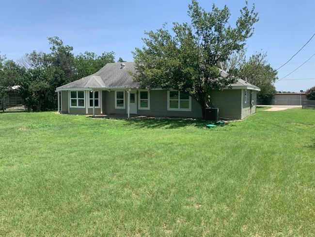 Back of house with a yard | Image 8