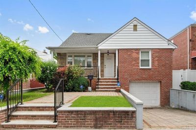 Bungalow-style home featuring a garage | Image 1