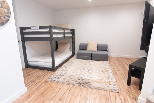 Bedroom featuring wood finished floors and baseboards | Image 28