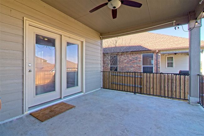 View of patio with a ceiling fan | Image 32