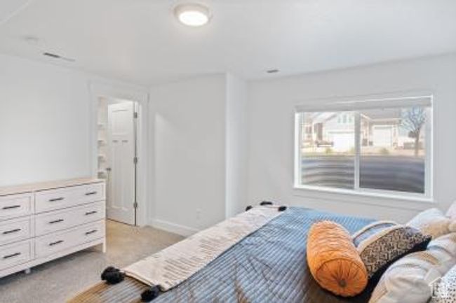 Bedroom featuring light carpet and baseboards | Image 21