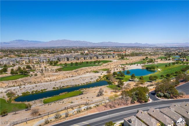 Birds eye view of property with a water and mountain view and view of golf course | Image 40