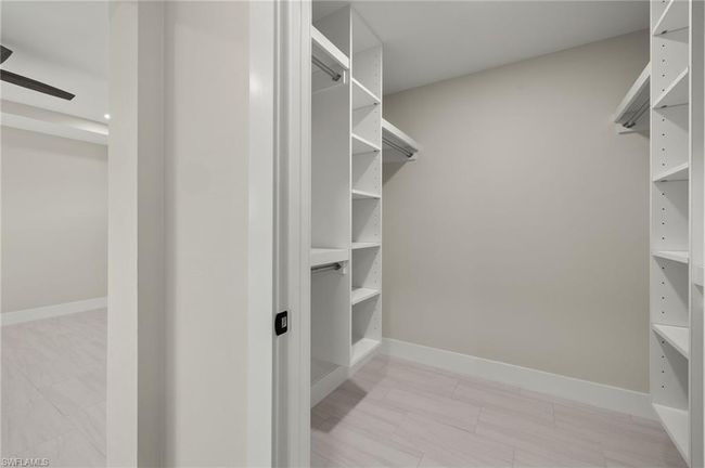 View of spacious Master bedroom closet | Image 28