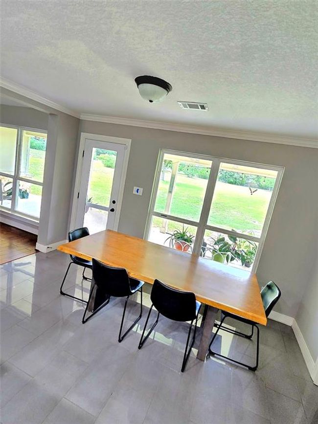 Breakfast area with views of the backyard and patio area. | Image 14