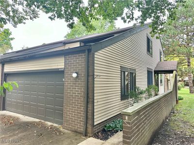 View of side of property with a garage | Image 1