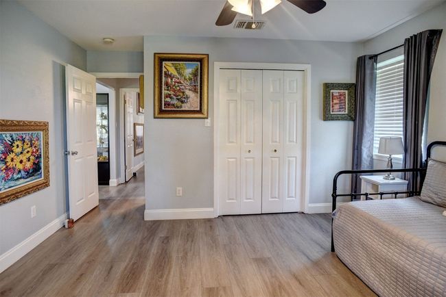Bedroom featuring vinyl floors, a closet, and a ceiling fan | Image 23