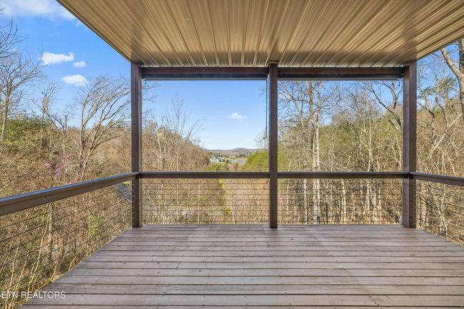 Enjoy the lower level covered deck from the Great Room. | Image 35