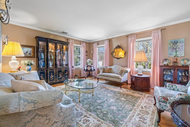 Living room featuring hardwood floors, plenty of natural light. | Image 5