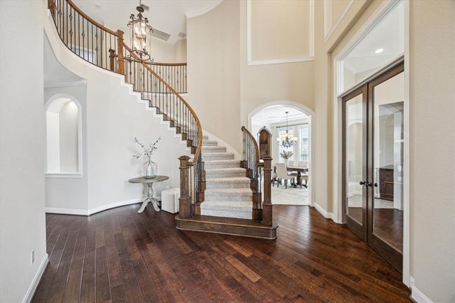 Soaring ceilings and gorgeous wood floors greet you as you enter this breathtakingly beautiful home | Image 8
