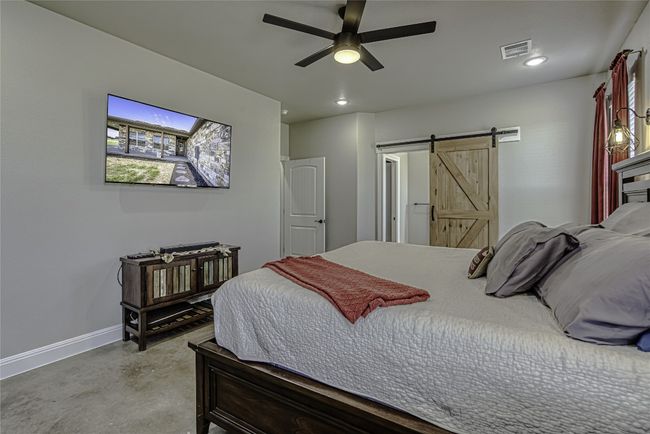 Primary bedroom with ceiling fan | Image 23