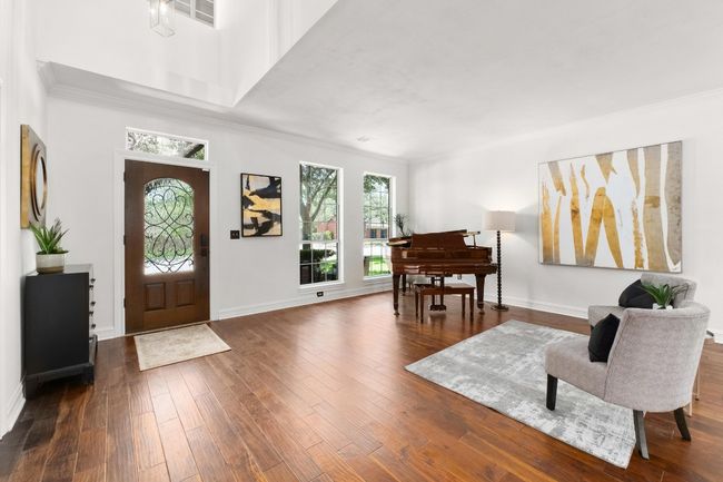 Foyer entrance with ornamental molding and wood-type flooring | Image 4