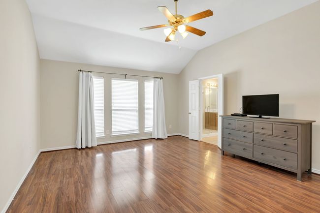 Primary bedroom open up to Primary Bath and has lots of Windows for light | Image 20