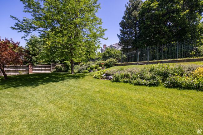 View of fenced backyard | Image 97
