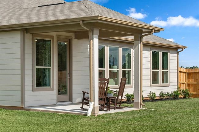 Come and see this spacious backyard with its beautiful covered patio. There is plenty of room for the kids to play and adults to relax! | Image 7