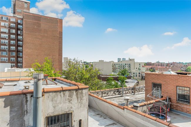 Balcony featuring a city view | Image 13