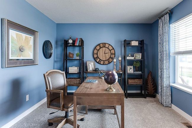 Working from home? This office is located at the front of the home and has a large window for natural light and French doors! Photo of former Model. Options and colors may vary. Ask Sales Agent for details. | Image 15