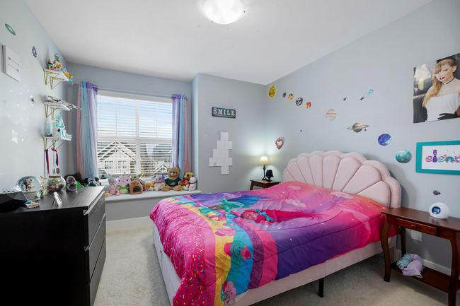 Bedroom with light carpet and baseboards | Image 24