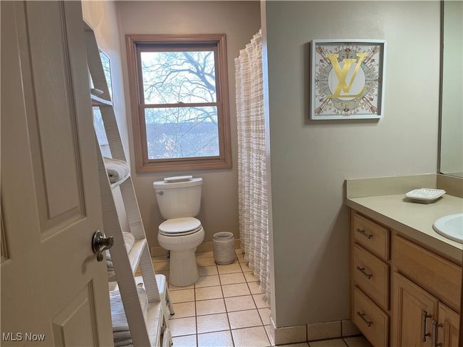 Upstiars Full Bathroom featuring tile patterned flooring, vanity, and toilet | Image 30