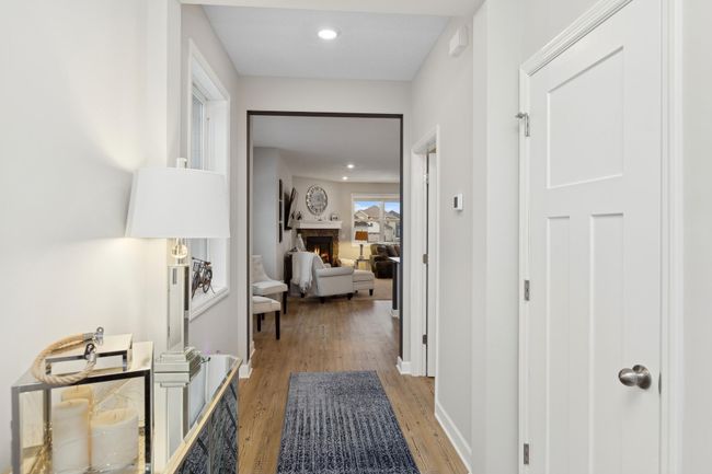 Main Level Highlights • Inviting front porch and sunlit foyer with a spacious entry closet. • Luxury vinyl plank (LVP) flooring flows seamlessly throughout. | Image 4