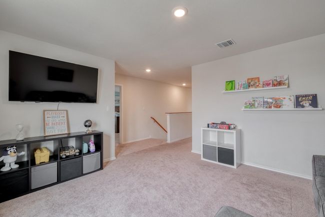 Playroom featuring carpet floors, baseboards, recessed lighting, and visible vents | Image 22