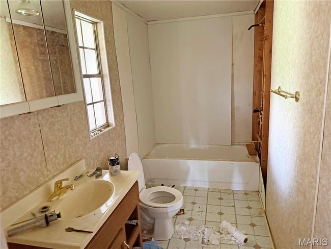 Full bathroom featuring vanity and shower / bath combination | Image 21