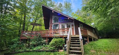 Back of property with a wooden deck | Image 2