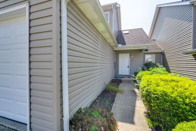 Property entrance with a garage | Image 2