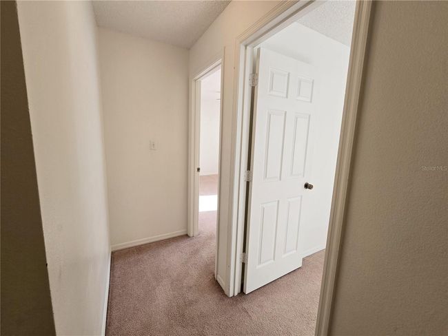 Another view of the full bathroom in hallway | Image 10