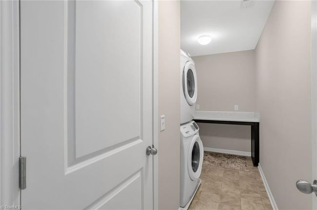 Laundry room with folding table | Image 19