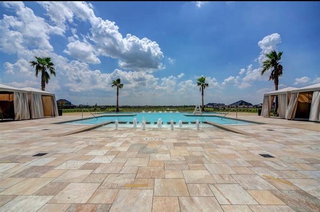 Imagine relaxing by your stunning pool, embracing a vibrant new lifestyle in this welcoming neighborhood. | Image 24