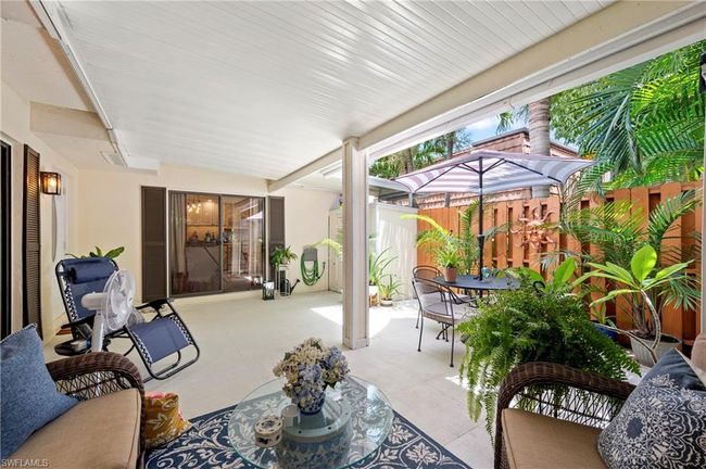 Fenced backyard featuring outdoor dining area and a patio area | Image 6