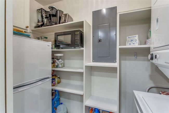 Accommodates full-size washer & dryer (right) & small refrigerator/freezer (left.) | Image 11